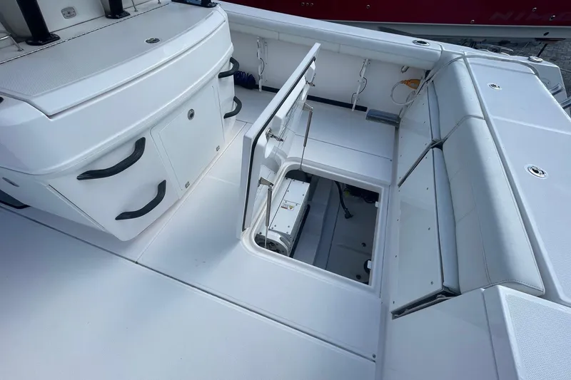 Slide: The Image of 2022 Everglades 335 Center Console boat interior with open storage compartment. - 4