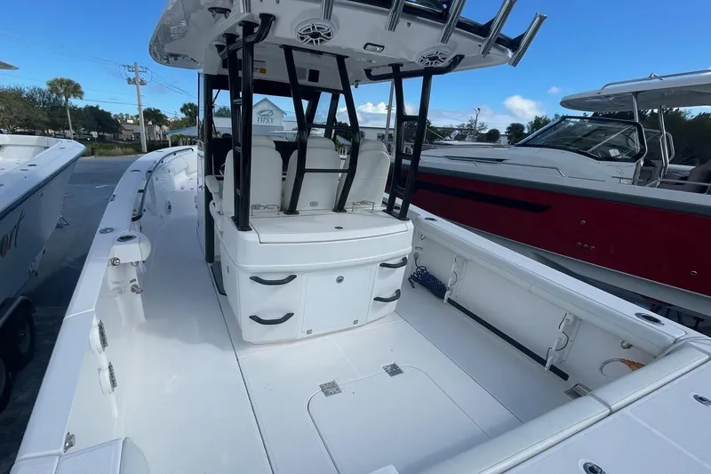 Slide: The Image of 2022 Everglades 335 Center Console boat with spacious deck and seating. - 7