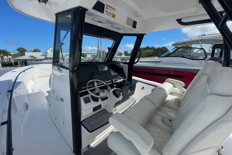 Slide: The Image of 2022 Everglades 335 Center Console boat interior with modern helm and seating. - 9