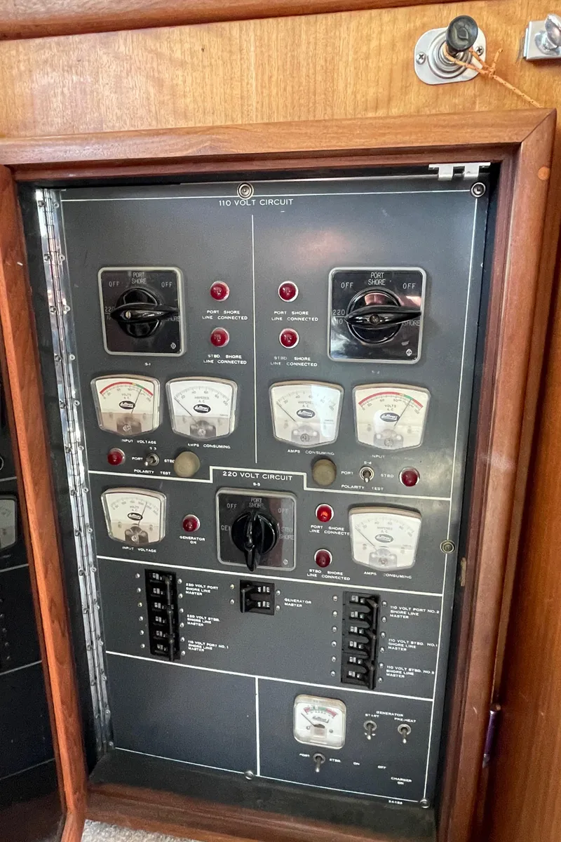 Slide: The Image of Electrical panel of a 1973 Hatteras 53 Motor Yacht with gauges and switches. - 32