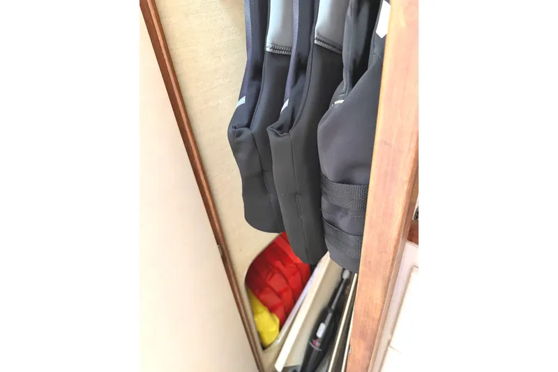 Slide: The Image of Life jackets and equipment storage on a 1974 Bertram 35 Convertible boat. - 13