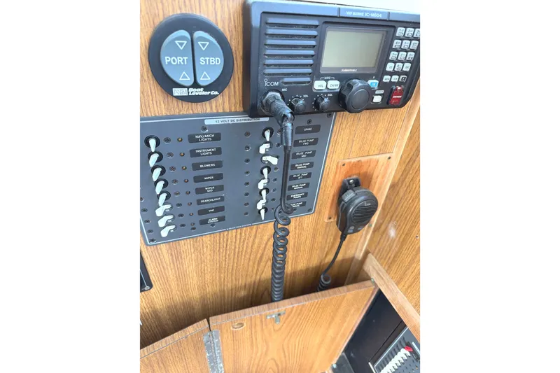 Slide: The Image of Control panel of a 1974 Bertram 35 Convertible boat with radio and switches. - 20
