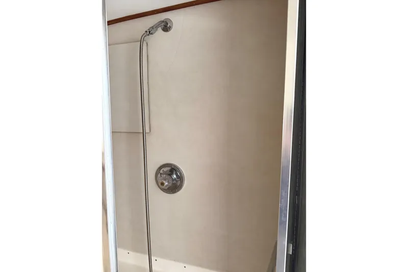 Slide: The Image of Shower area inside a 1974 Bertram 35 Convertible boat. - 23