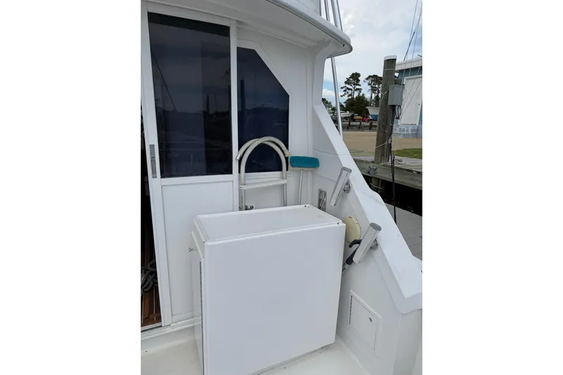 Slide: The Image of 1974 Bertram 35 Convertible boat deck with storage and cleaning station. - 35