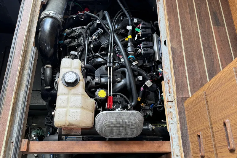 Slide: The Image of Engine compartment of a 1974 Bertram 35 Convertible boat, showcasing intricate mechanical components. - 40