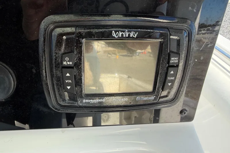 Slide: The Image of Infinity PRV-450 stereo system on 2017 Sea Hunt Triton 225 boat dashboard. - 17