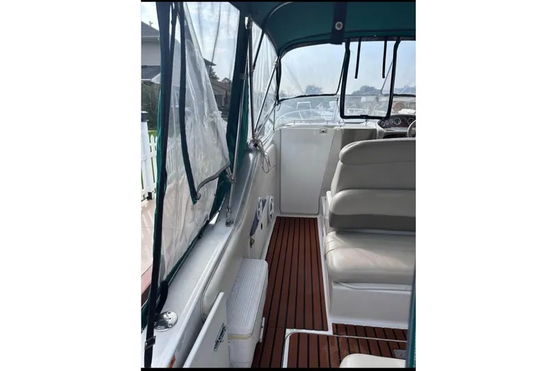 Slide: The Image of 2000 Four Winns 268 Vista boat interior with seating and wood flooring. - 7