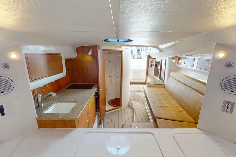 Slide: The Image of Luxurious interior of 2007 Midnight Express 37 Cabin boat with kitchenette and seating area. - 11