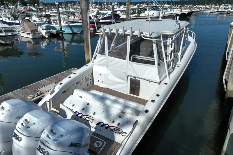 Slide: The Image of 2007 Midnight Express 37 Cabin boat docked with triple Mercury 350 engines. - 14