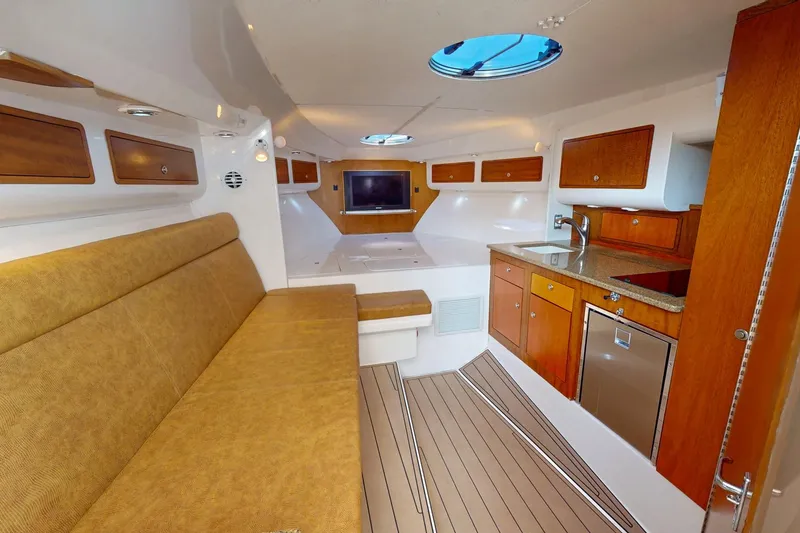 Slide: The Image of Luxurious interior of 2007 Midnight Express 37 Cabin boat with wood accents and modern amenities. - 18