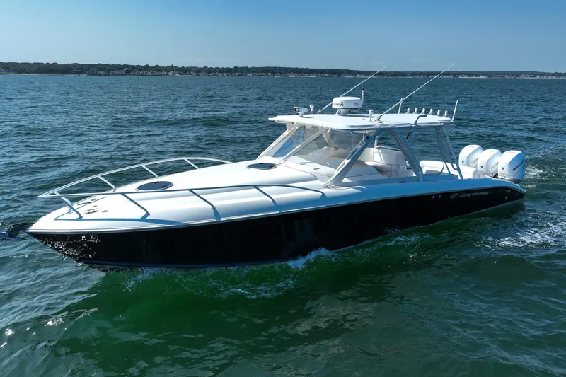 Slide: The Image of 2007 Midnight Express 37 Cabin boat cruising on open water. - 2