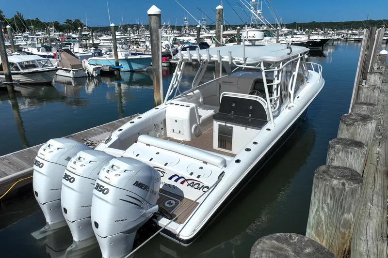 Slide: The Image of 2007 Midnight Express 37 Cabin boat docked with triple Mercury 350 engines. - 4