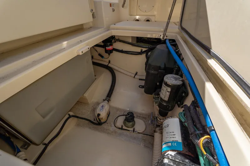 Slide: The Image of Engine compartment of 2018 Chris-Craft Calypso 26 boat, showcasing mechanical components. - 39