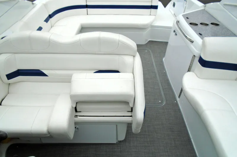 Slide: The Image of 2007 Formula 280 Bowrider interior with white seating and blue accents. - 19