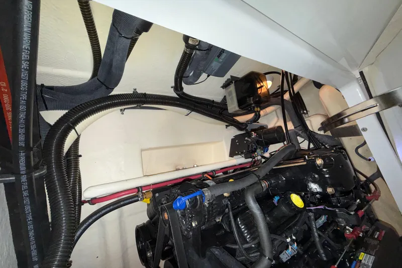 Slide: The Image of Engine compartment of a 2007 Formula 280 Bowrider with visible wiring and components. - 23