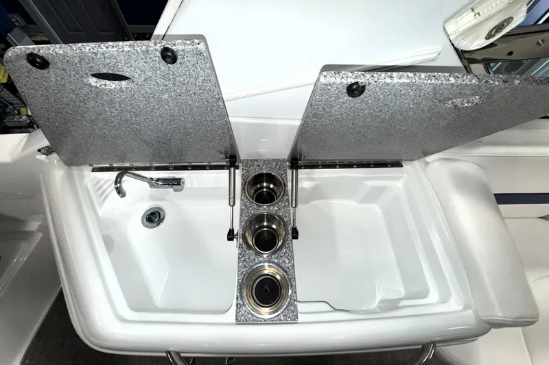 Slide: The Image of 2007 Formula 280 Bowrider sink and cup holders with open lids. - 27