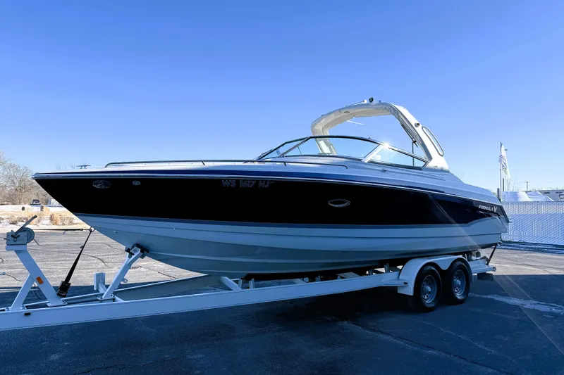 Slide: The Image of 2007 Formula 280 Bowrider boat on trailer under clear blue sky. - 3