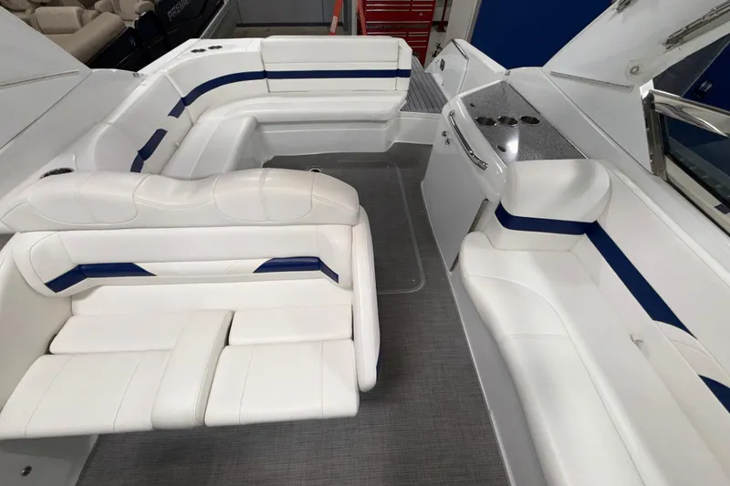 Slide: The Image of 2007 Formula 280 Bowrider interior with white and blue seating, spacious layout. - 30