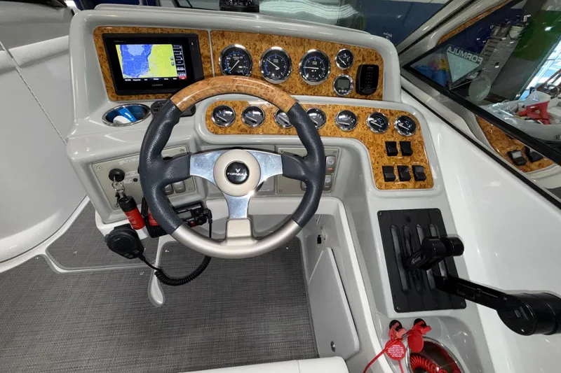Slide: The Image of 2007 Formula 280 Bowrider dashboard with steering wheel and navigation controls. - 31