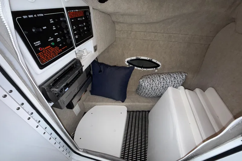Slide: The Image of Interior cabin of a 2007 Formula 280 Bowrider boat with control panels and cushions. - 36