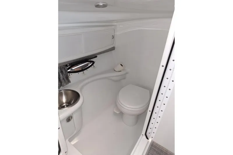 Slide: The Image of 2007 Formula 280 Bowrider boat bathroom with toilet and sink. - 43