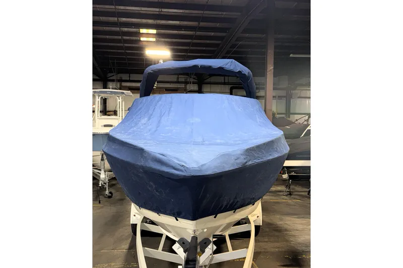 Slide: The Image of 2007 Formula 280 Bowrider with blue cover in indoor storage. - 44
