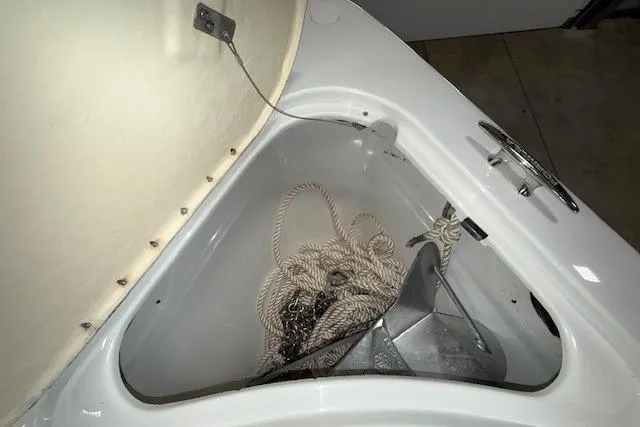 Slide: The Image of Anchor storage compartment on a 2007 Formula 280 Bowrider with rope and chain. - 5