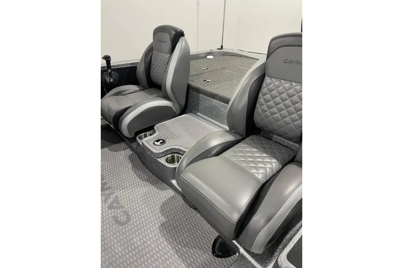 Slide: The Image of 2023 Caymas CX 18 S boat interior with gray quilted seats and cup holders. - 5
