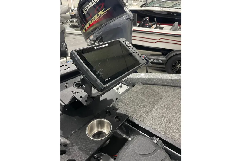 Slide: The Image of 2023 Caymas CX 18 S boat dashboard with Humminbird Helix 9 fishfinder and Yamaha engine. - 7