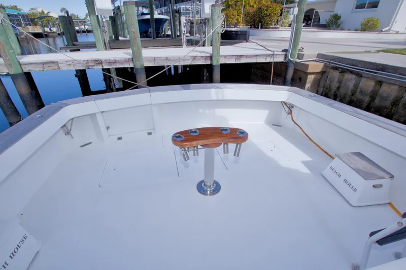 Slide: The Image of 1990 Viking 53 Convertible yacht cockpit with clean deck and fishing chair. - 19