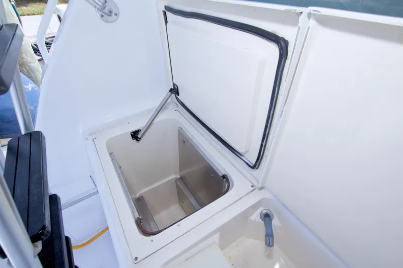 Slide: The Image of Open storage compartment on a 1990 Viking 53 Convertible boat deck. - 22