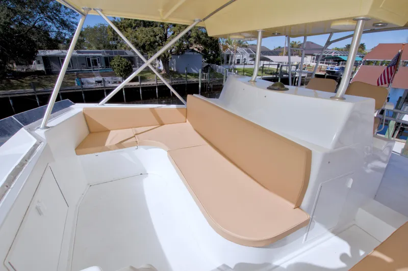 Slide: The Image of 1990 Viking 53 Convertible yacht with spacious outdoor seating area. - 34