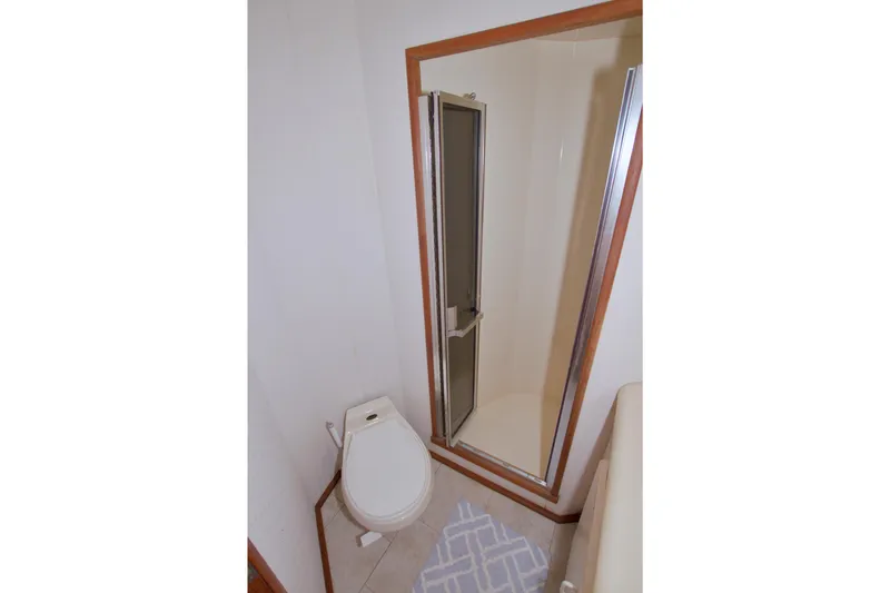 Slide: The Image of Bathroom interior of 1990 Viking 53 Convertible yacht with shower and toilet. - 59