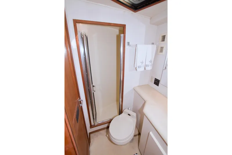 Slide: The Image of Bathroom interior of 1990 Viking 53 Convertible yacht with shower and toilet. - 62