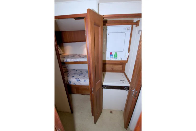 Slide: The Image of Interior of 1990 Viking 53 Convertible yacht with bunk beds and laundry area. - 71