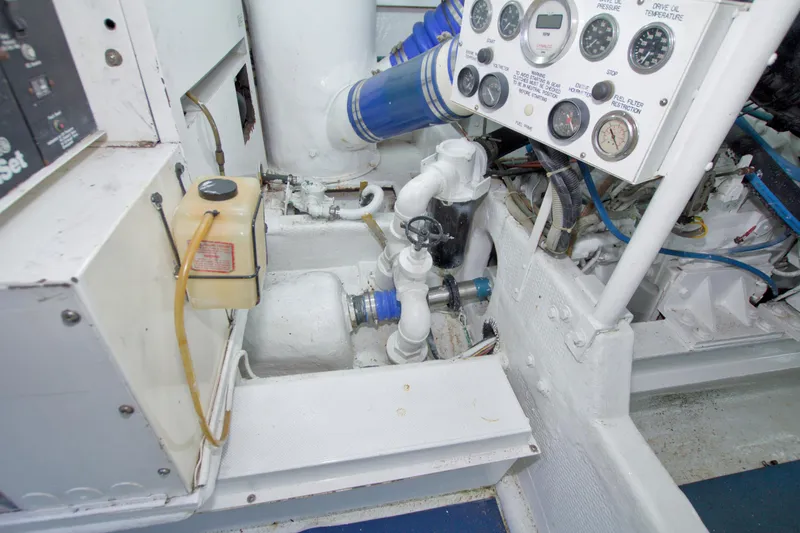 Slide: The Image of Engine room of 1990 Viking 53 Convertible with gauges and piping. - 81