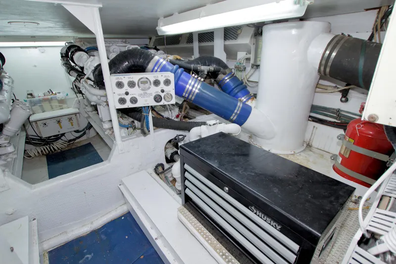 Slide: The Image of Engine room of 1990 Viking 53 Convertible yacht with control panel and tool chest. - 86