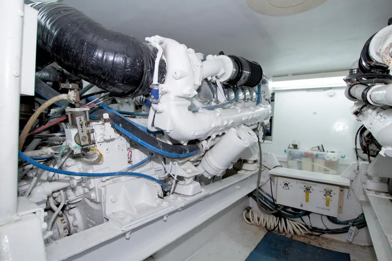 Slide: The Image of Engine room of a 1990 Viking 53 Convertible yacht, showcasing mechanical components. - 89