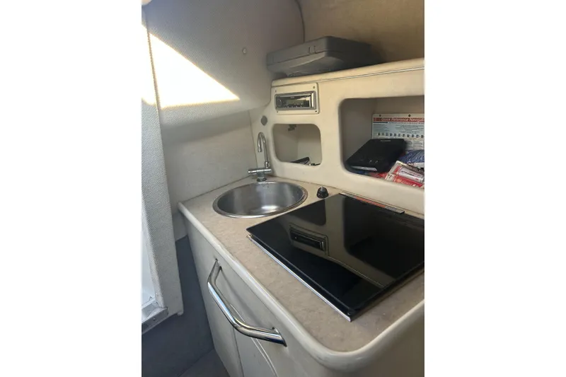 Slide: The Image of Galley in a 2007 Sea Ray 250 Amberjack yacht. - 12