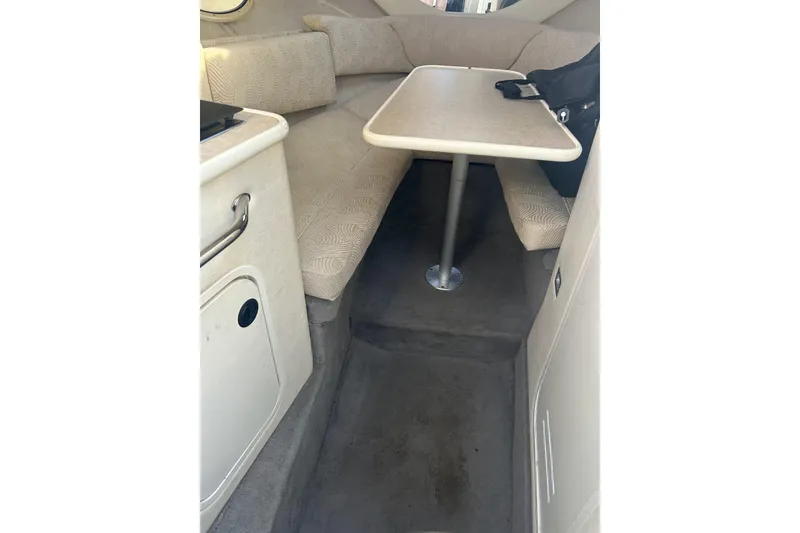 Slide: The Image of Interior of 2007 Sea Ray 250 Amberjack with table and seating area. - 16