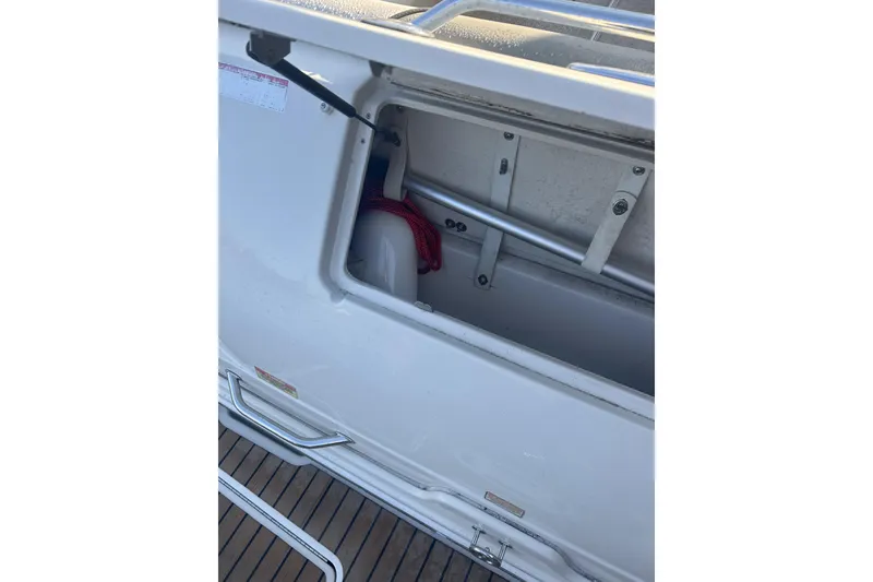 Slide: The Image of Storage compartment on a 2007 Sea Ray 250 Amberjack boat. - 22