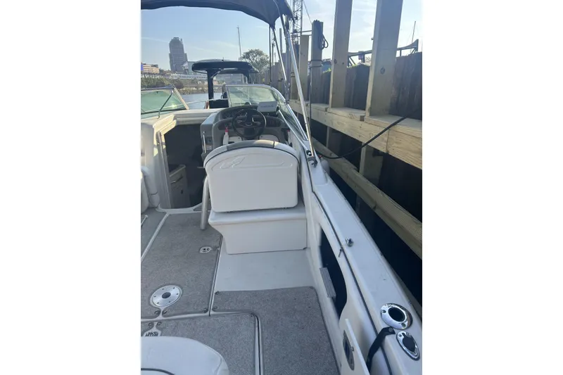 Slide: The Image of Interior view of a 2007 Sea Ray 250 Amberjack boat at dock. - 23