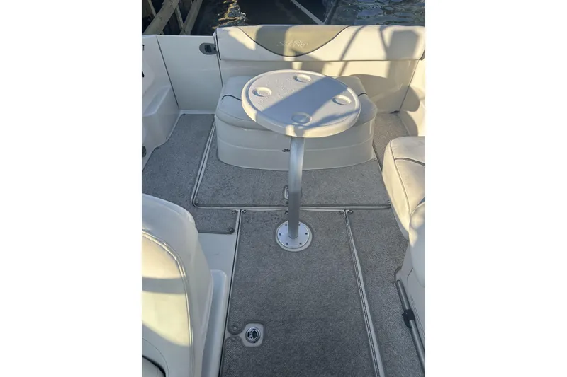 Slide: The Image of Interior of 2007 Sea Ray 250 Amberjack with table and seating area. - 6