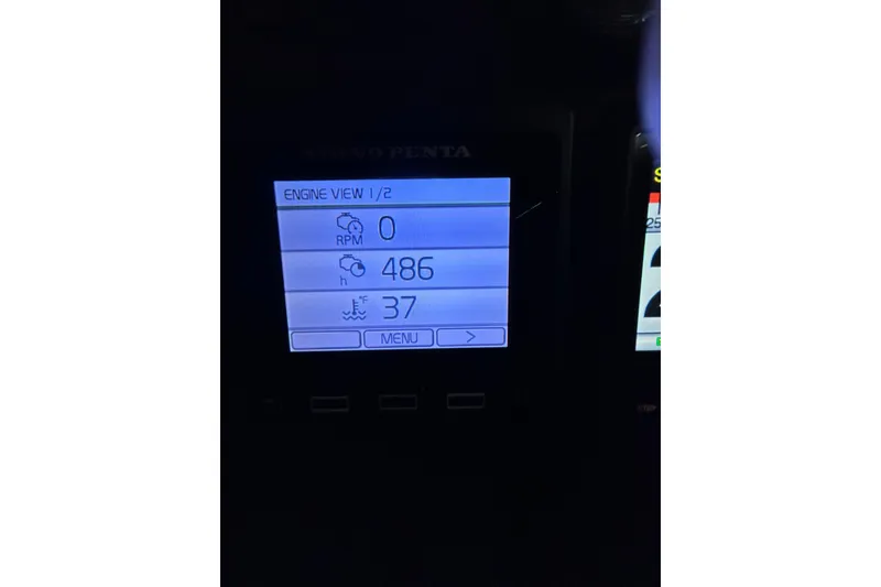 Slide: The Image of Volvo Penta engine display showing RPM, hours, and temperature on a 2017 Ranger Tugs R-25 SC. - 10