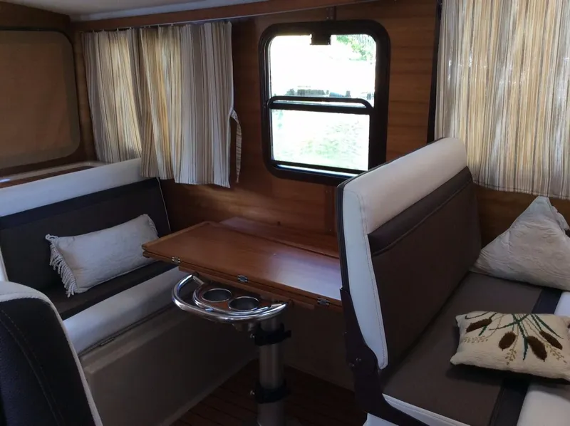 Slide: The Image of Interior of 2017 Ranger Tugs R-25 SC with cozy seating area. - 11