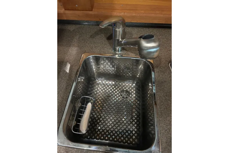 Slide: The Image of Stainless steel sink and faucet in 2017 Ranger Tugs R-25 SC boat. - 13