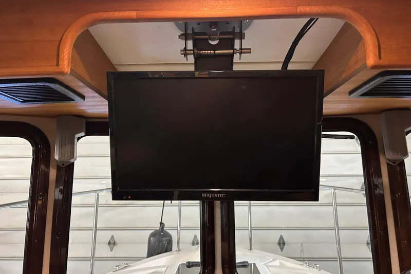 Slide: The Image of 2017 Ranger Tugs R-25 SC interior with mounted Majestic TV screen. - 17