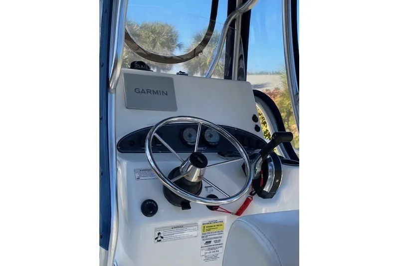 Slide: The Image of Control panel of a 2015 Boston Whaler 190 Outrage boat with Garmin navigation. - 1