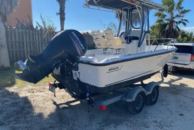 Slide: The Image of 2015 Boston Whaler 190 Outrage boat on trailer with Mercury outboard motor. - 9