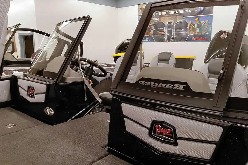 Slide: The Image of 2026 Ranger 1880MS Angler boat interior with steering wheel and seating. - 10